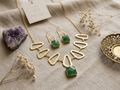 Golden necklace with earrings with beautiful green stones